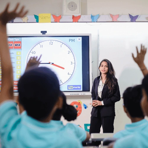 Teacher conducting an interactive session with students at Cresmonde World School